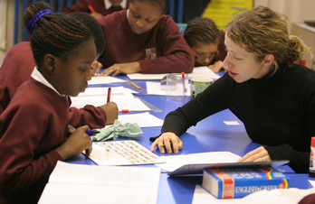 Photograph of a teacher and child