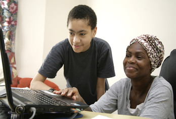 Mother and son on laptop